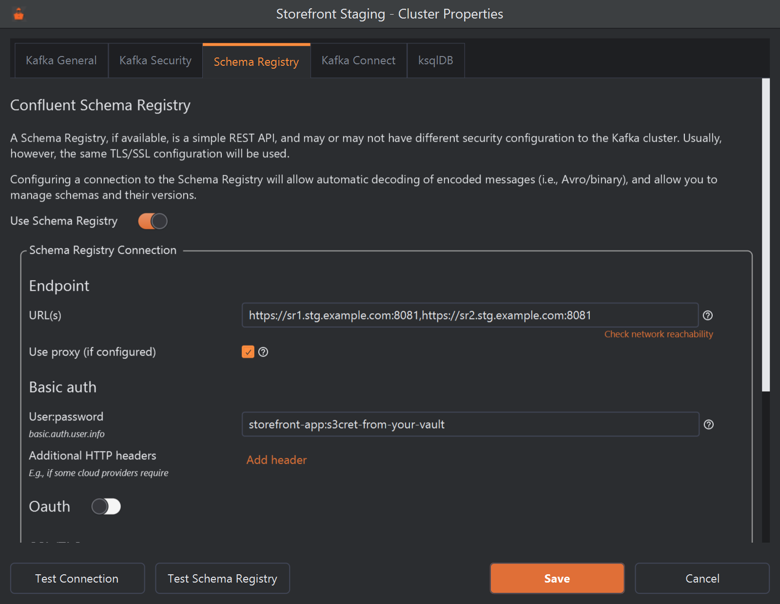 The Schema Registry tab of the Cluster Properties dialog for the Storefront Staging cluster. Use Schema Registry is switched on. Under Endpoint, URL(s) holds two https URLs separated by a comma without a space, with a Check network reachability link below it, and Use proxy (if configured) is ticked. Under Basic auth, User:password holds storefront-app:s3cret-from-your-vault, followed by Additional HTTP headers with an Add header link, then an Oauth switch that is off. At the bottom are Test Connection, Test Schema Registry, Save and Cancel.