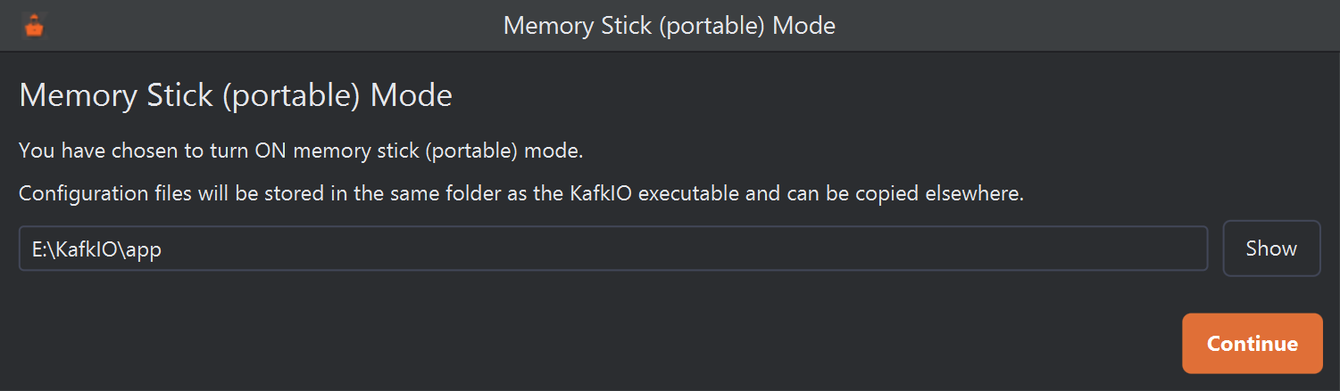 The Memory Stick (portable) Mode window. It reads: You have chosen to turn ON memory stick (portable) mode. Configuration files will be stored in the same folder as the KafkIO executable and can be copied elsewhere. Below is a read-only field containing E:\KafkIO\app with a Show button, and a Continue button at the bottom right.